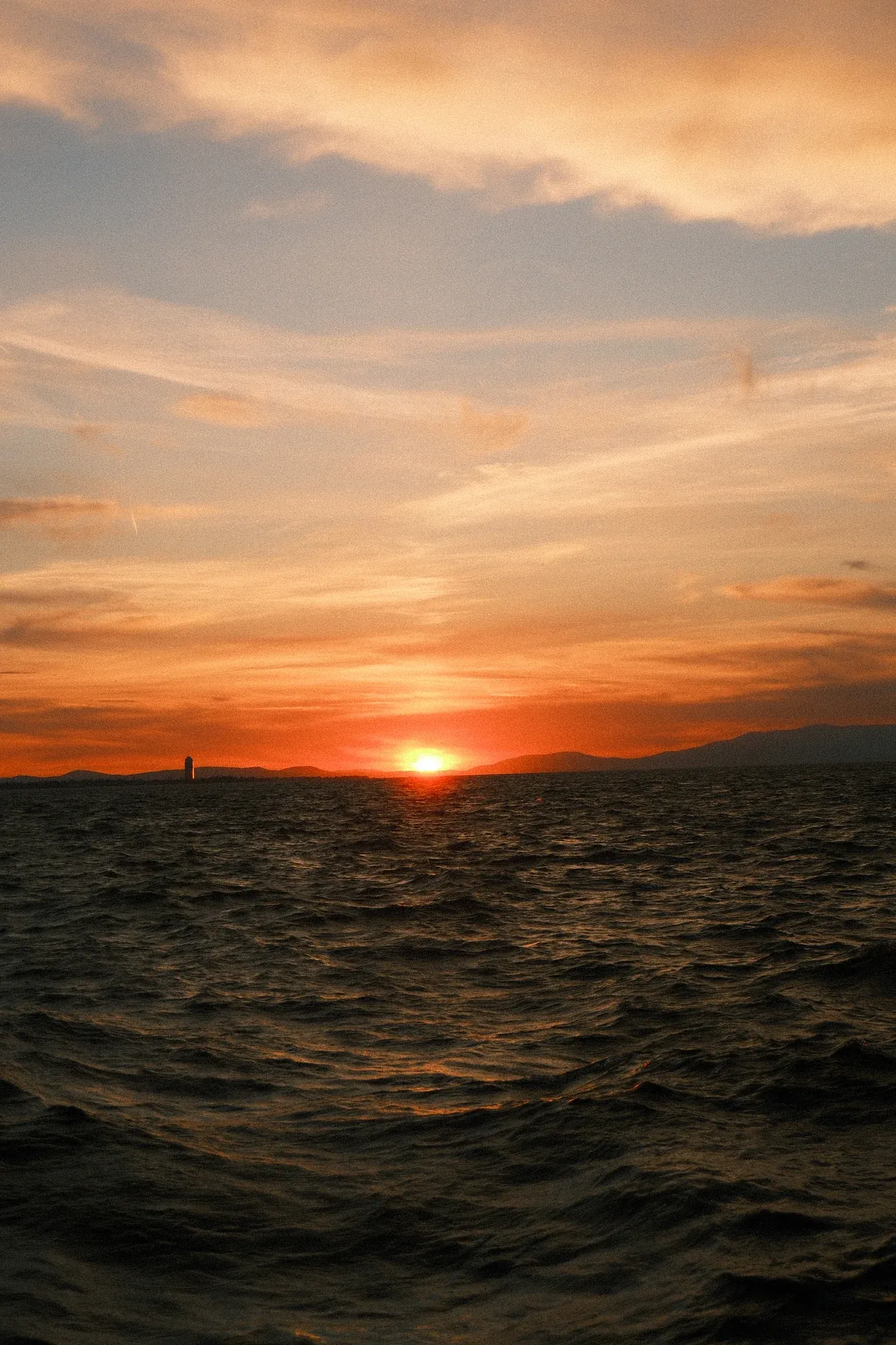 Golden sunset over the waves of the Aegean Sea in Izmir
